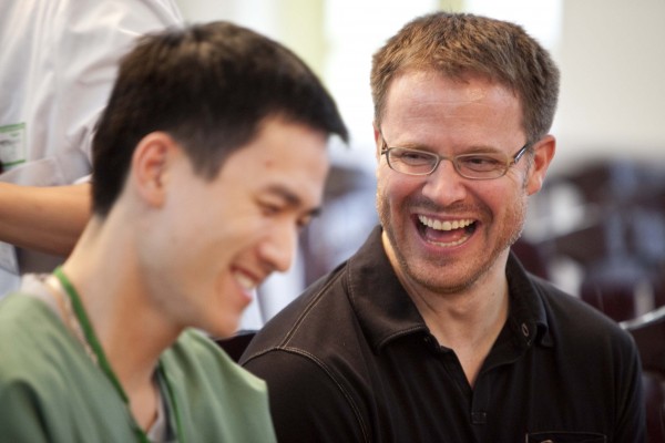 REI volunteer and Vietnamese surgeon enjoy each other