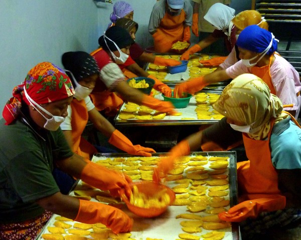 REI-Indonesia's employees preparing to dry the mangos they've harvested! 